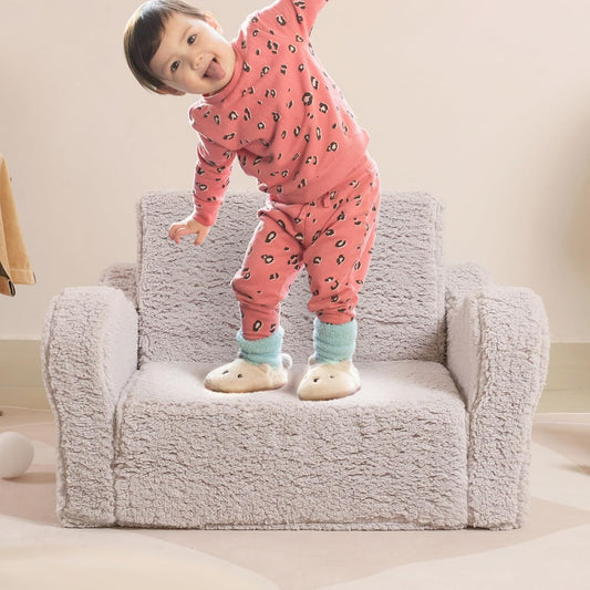 Image displaying a kid playing with a soft modular play furniture