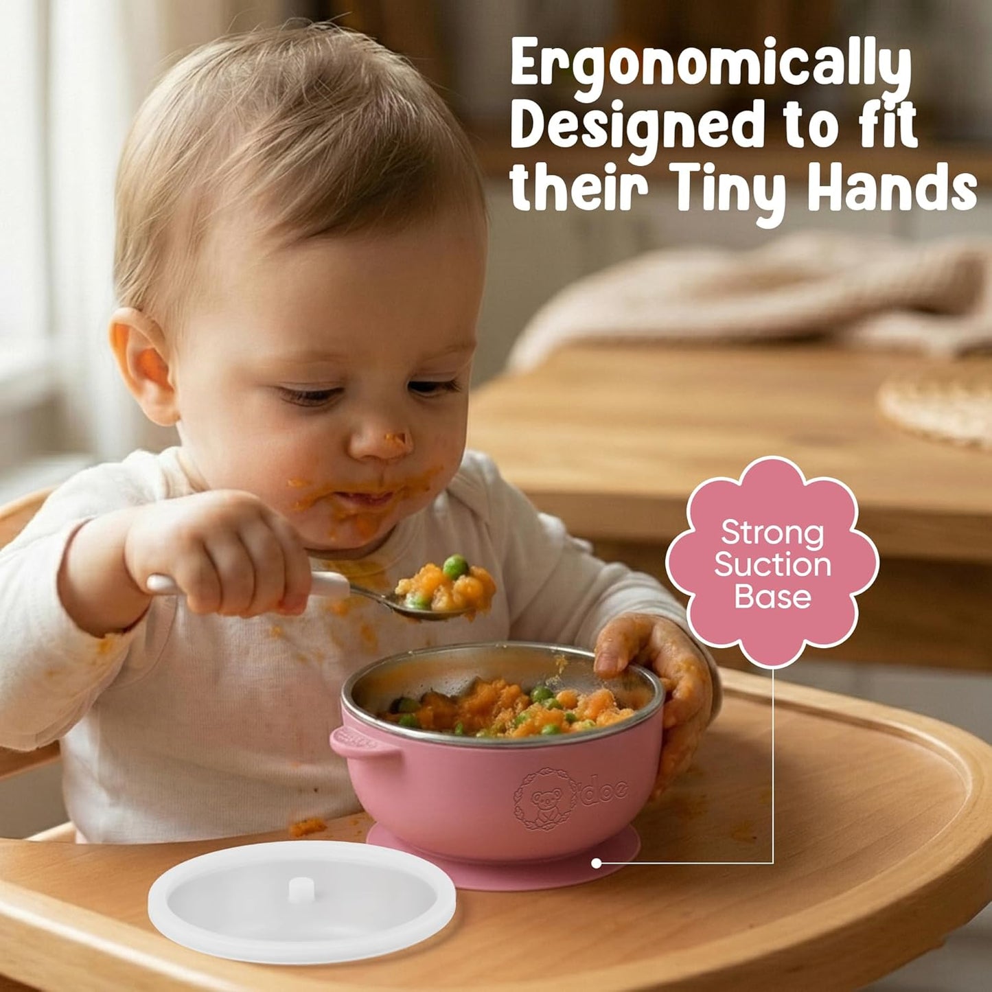 Baby eating from BPA-free stainless steel and silicone suction bowl designed to reduce spills and support safe feeding.