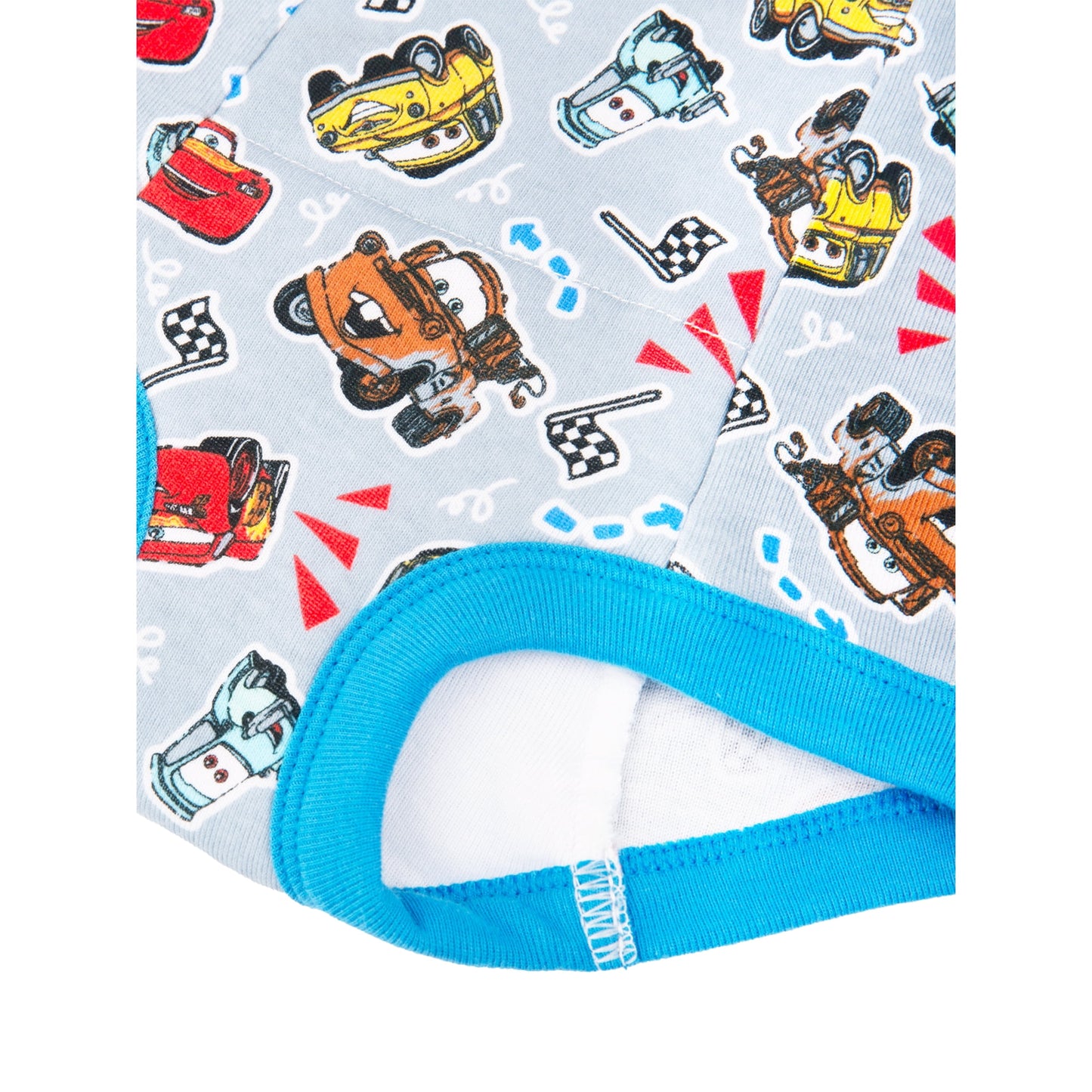 A close-up view of a light blue fabric with a repeating pattern of cartoon race cars and checkered flags, with white background