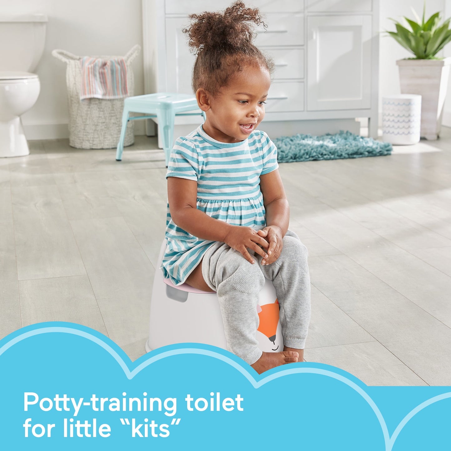 Toddler on a potty-training toilet, text "Potty-training toilet for little 'kits'" at bottom left in blue clouds