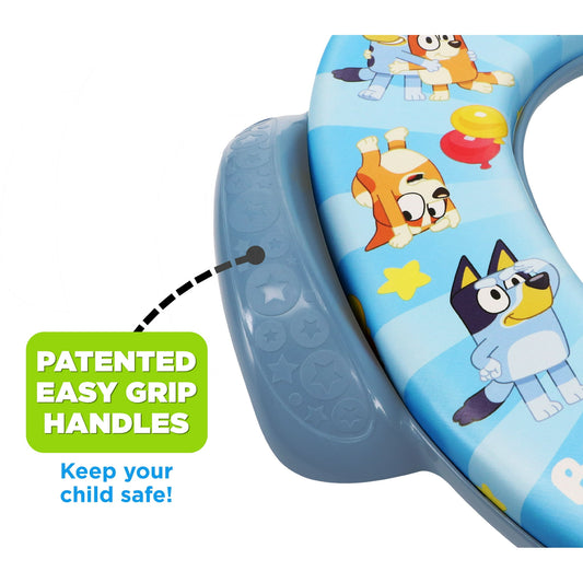 A child's potty training seat featuring cartoon characters and easy grip handles