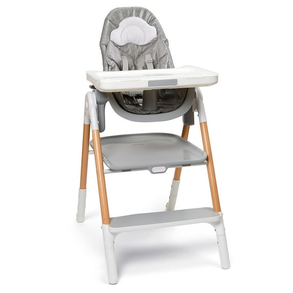 Baby high chair with gray cushion and wooden legs on a white background
