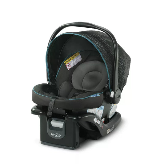 Black baby car seat on a white background