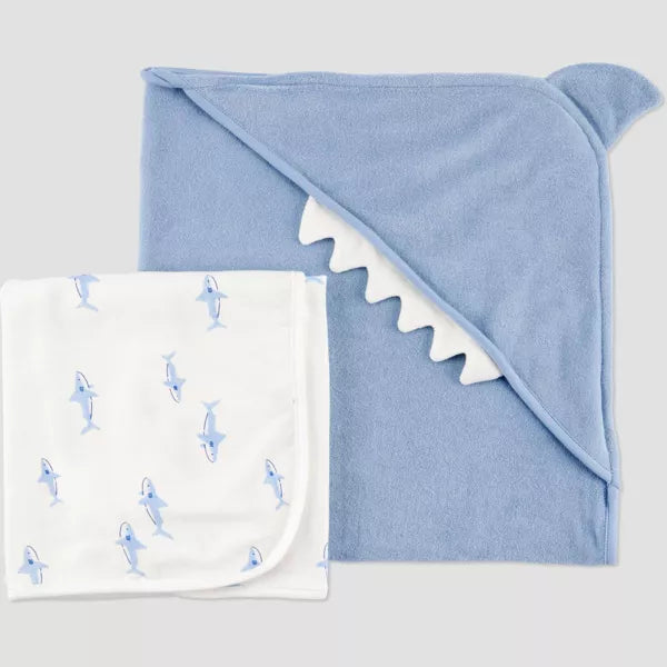 Blue hooded towel with shark design on a white background