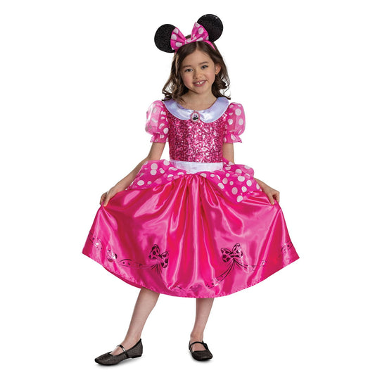 Child wearing a pink Minnie Mouse Halloween costume with ears on a white background