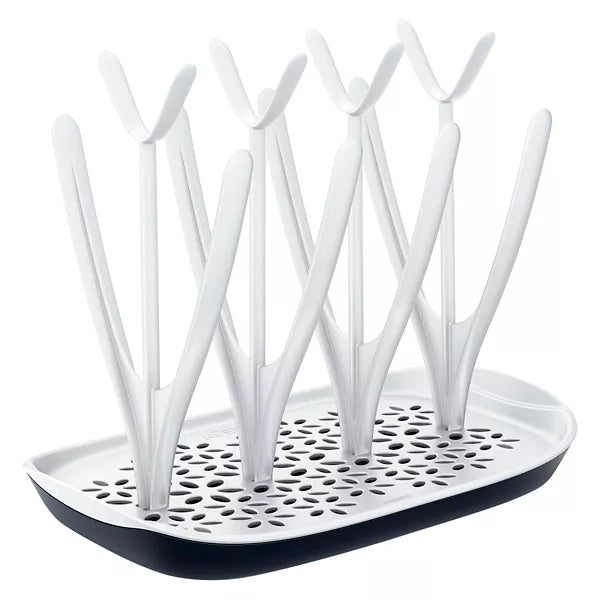 Compact baby bottle drying rack with vertical pegs for drying bottles, nipples, and pump parts – space-saving countertop solution for hygienic air-drying.