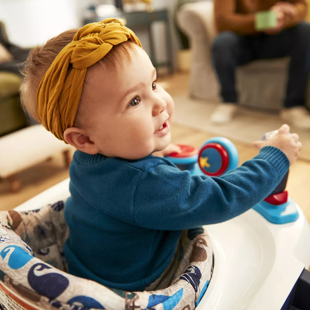 Image displaying a toddler in a baby activity walker
