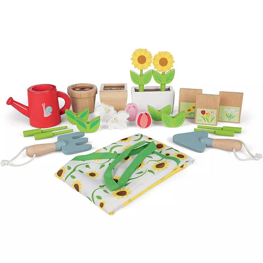 Wooden toy gardening set featuring pots, tools, seed packets, watering can, and flowers