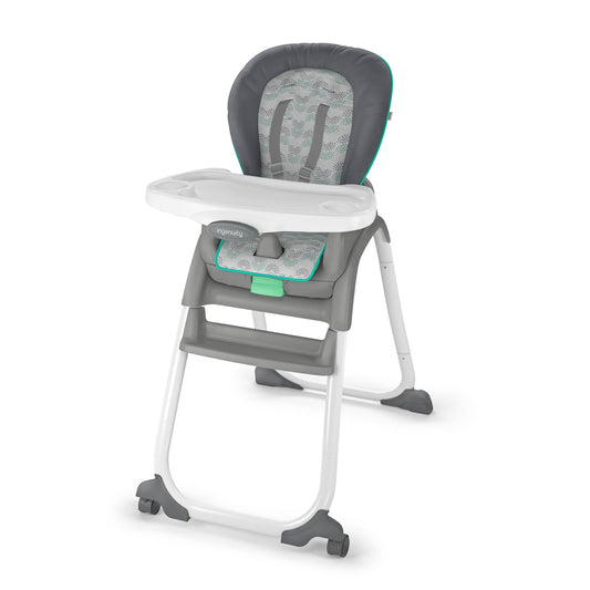 Gray and white high chair with green accents on a white background