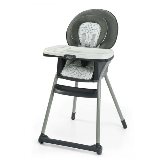 Gray and white high chair with patterned seat on a white background