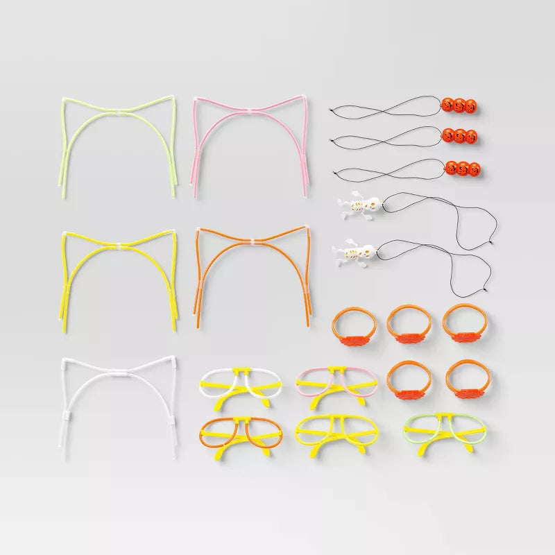 Halloween Themed Collection of colorful cat ears and accessories on a light gray background