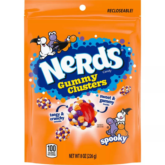 Halloween themed candy, Orange packaging with Gummy Clusters with cartoon characters on a white background