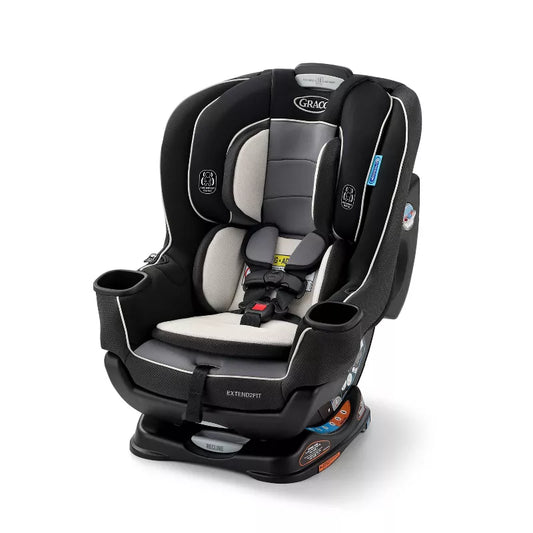 Infant car seat in black and grey, designed for safety and comfort during travel.