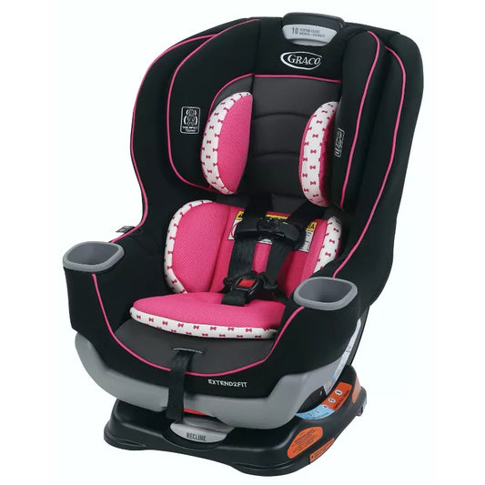 Pink and black car seat on a white background