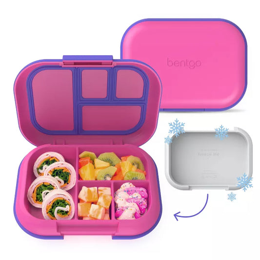 Pink bento lunch box with compartments filled with food and a separate gray lid on a white background