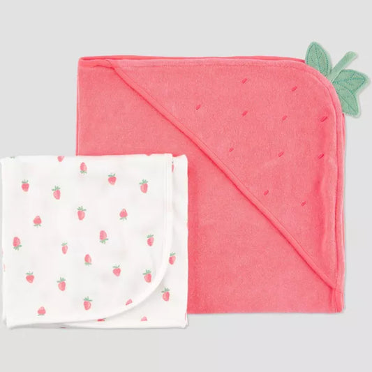 Pink hooded towel with strawberry pattern and green leaf on a white background