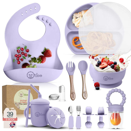 Purple baby feeding and utensils set with various items on a white background