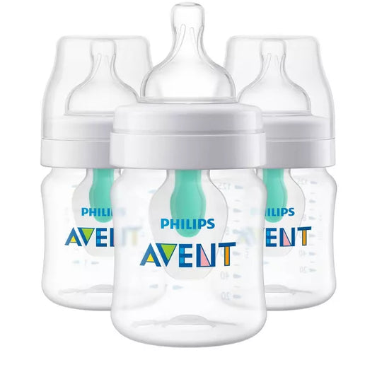 Set of four baby bottles on a white background
