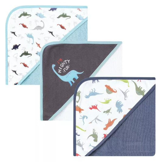 Set of three baby blankets with dinosaur patterns on a white background