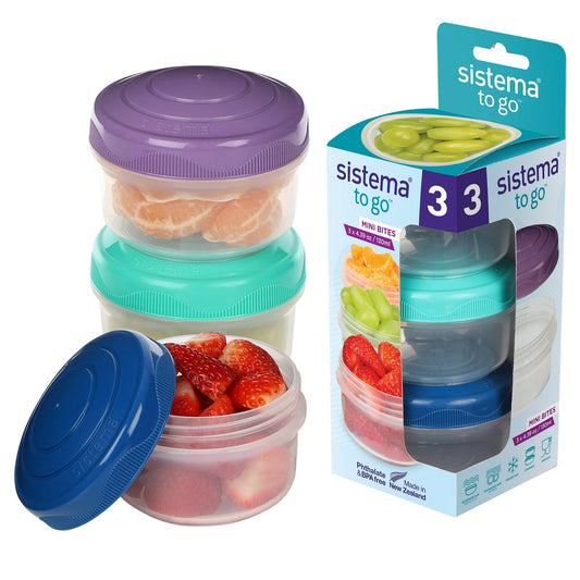 Set of three stacked food containers with colorful lids next to their packaging.