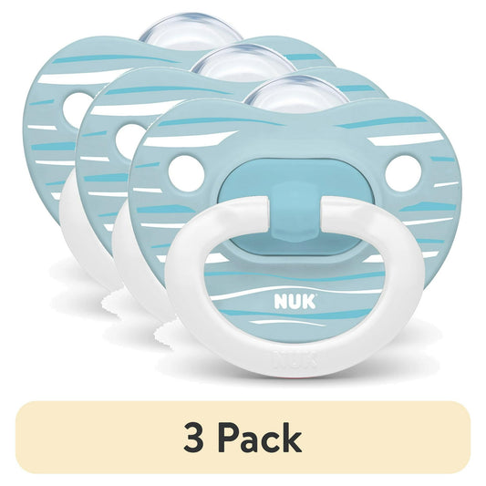 Three pacifiers with blue and white design on a beige background