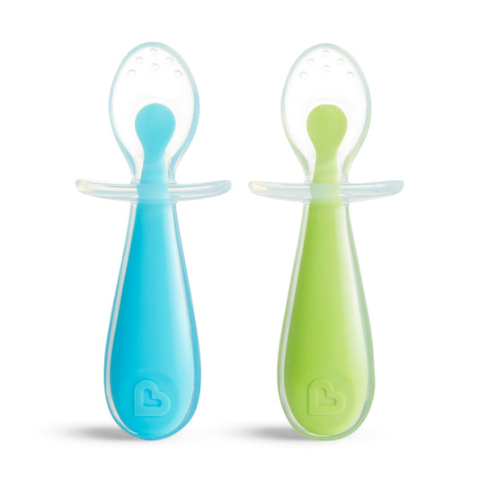 Two baby feeding spoons, one blue and one green, on a white background.