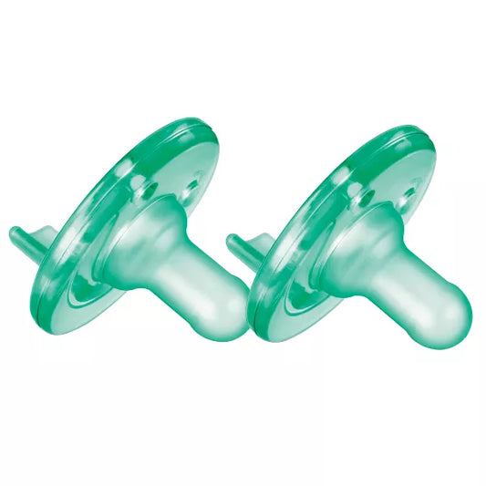 Two green pacifiers on a white background