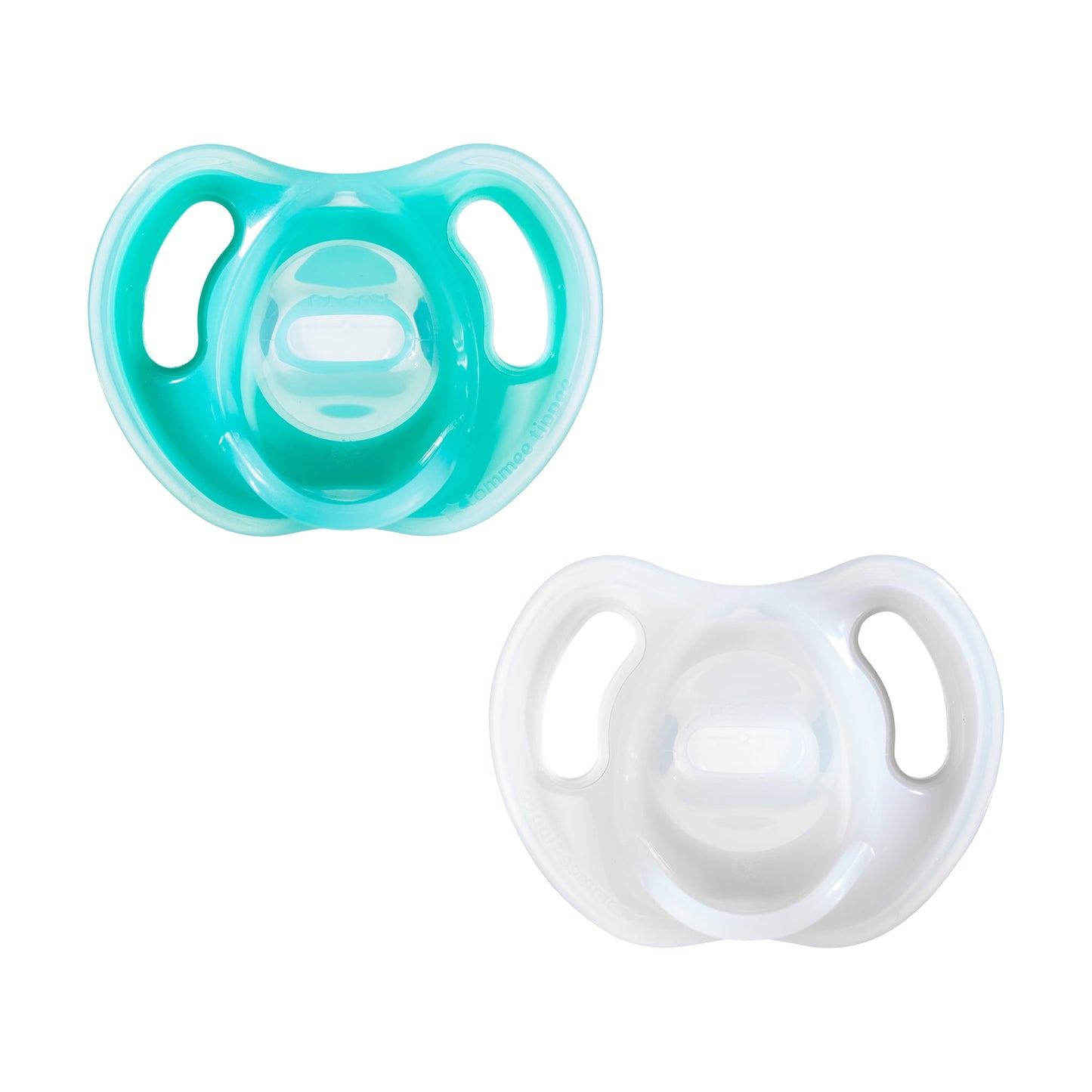 Two pacifiers, one turquoise and one white, on a white background