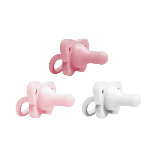 Two pink pacifiers and one white pacifier on a white background