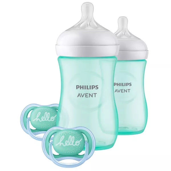 Two turquoise bottles with two matching pacifiers on a white background