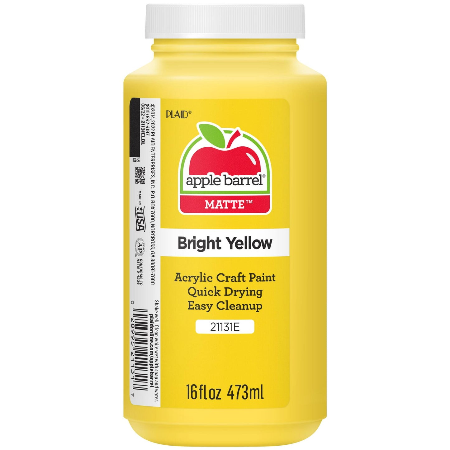 Yellow bottle of acrylic craft paint on a white background