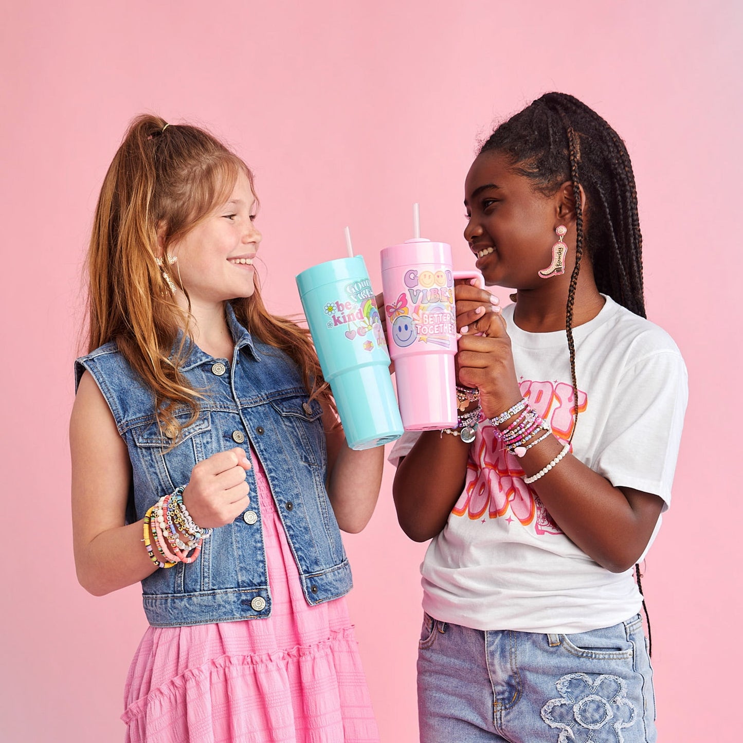 Image displaying two kids holding tumberls