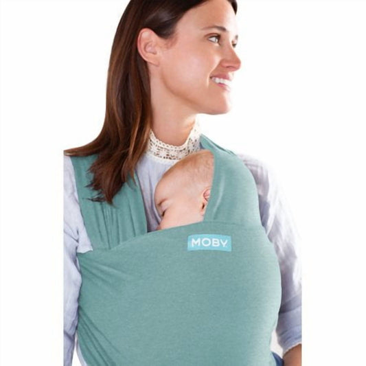 Image displaying a woman carrying a baby in a baby carrie