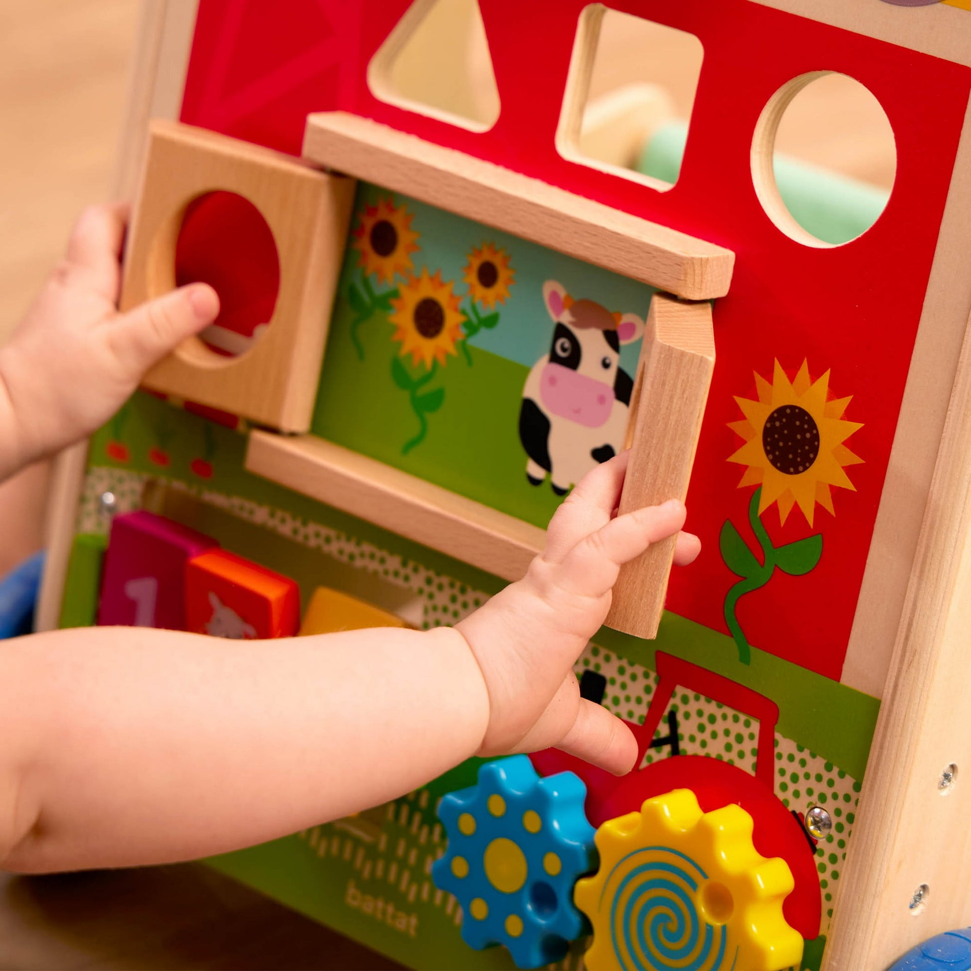 Image displaying a baby playing with a baby activity walker