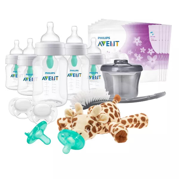 baby product set including bottles, pacifiers, and a giraffe toy on a white background.