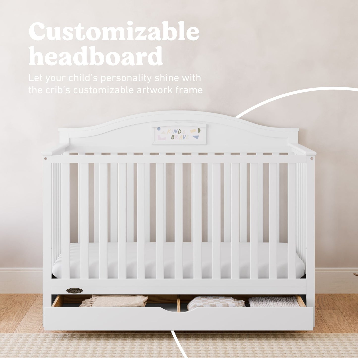 White baby crib with a customizable headboard and storage drawer underneath