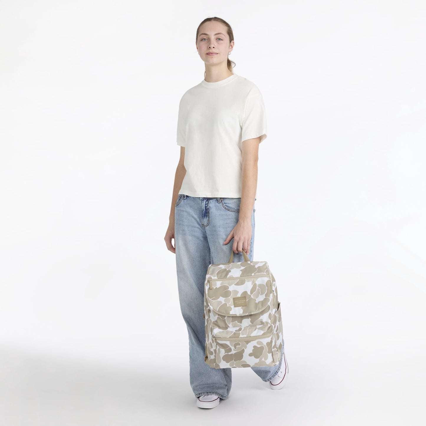 Women's top loader backpack featuring a roomy main compartment for laptops, books, and daily essentials.