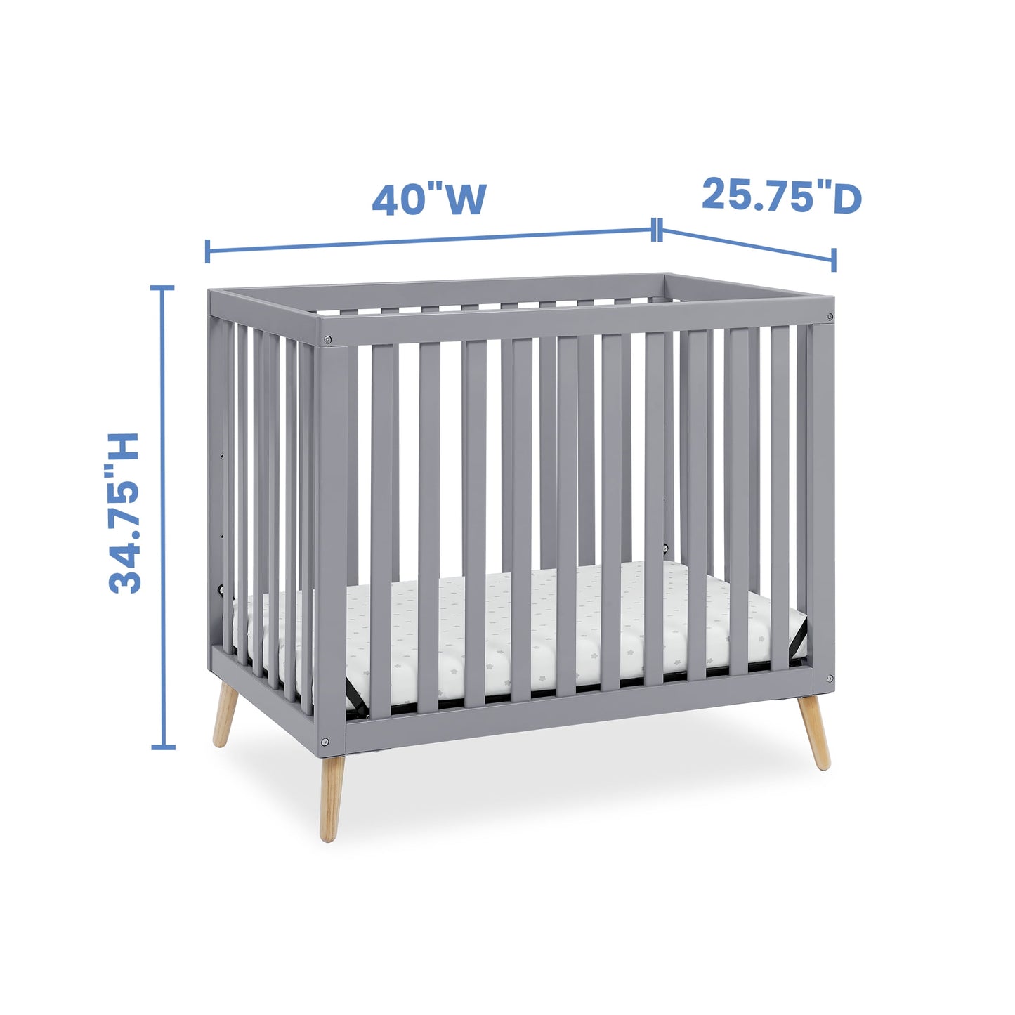 A gray baby crib with natural wood legs and mattress, displaying height, width, and depth dimensions