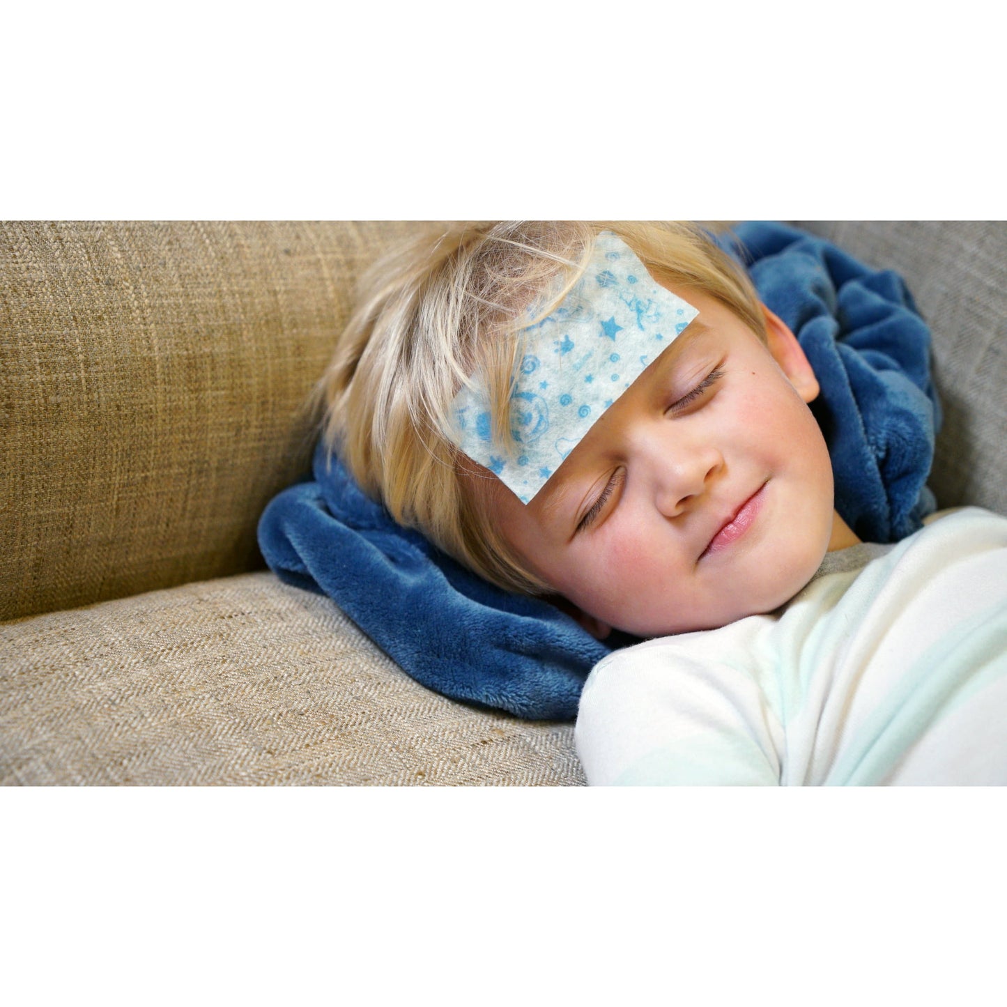 Image showing a kid lying with a soft gel sheet on his head