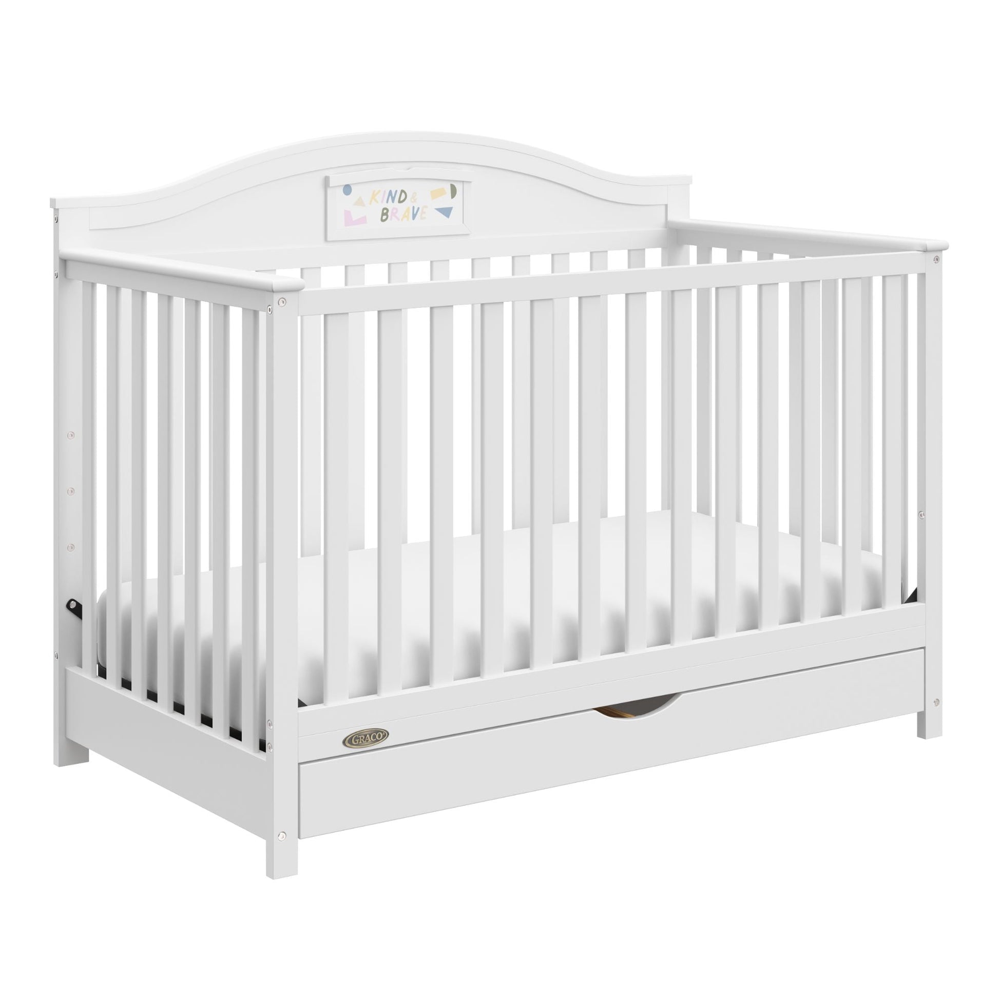 A white convertible baby crib with vertical slats and an integrated storage drawer underneath
