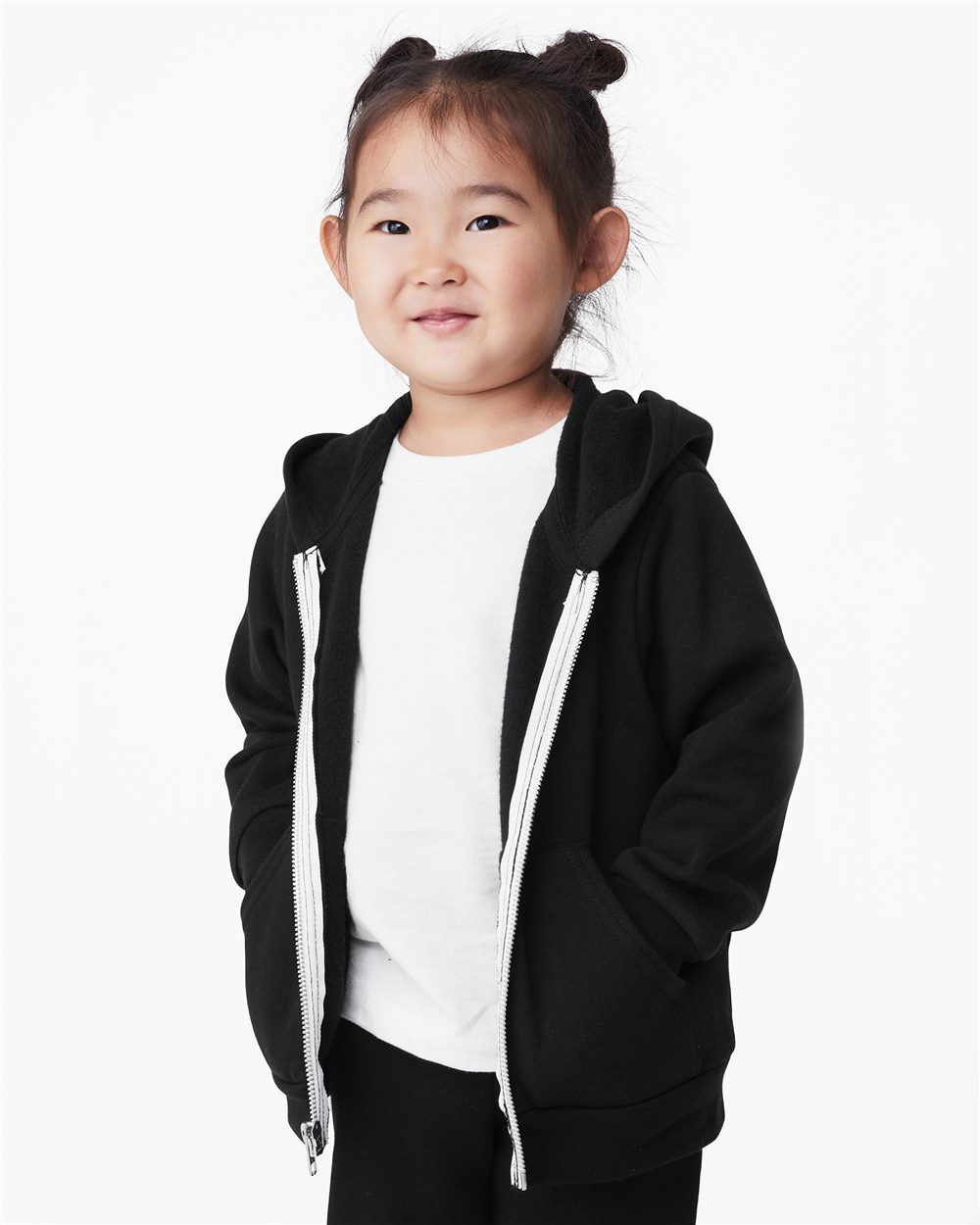 Child wearing a black hoodie with white drawstrings on a white background