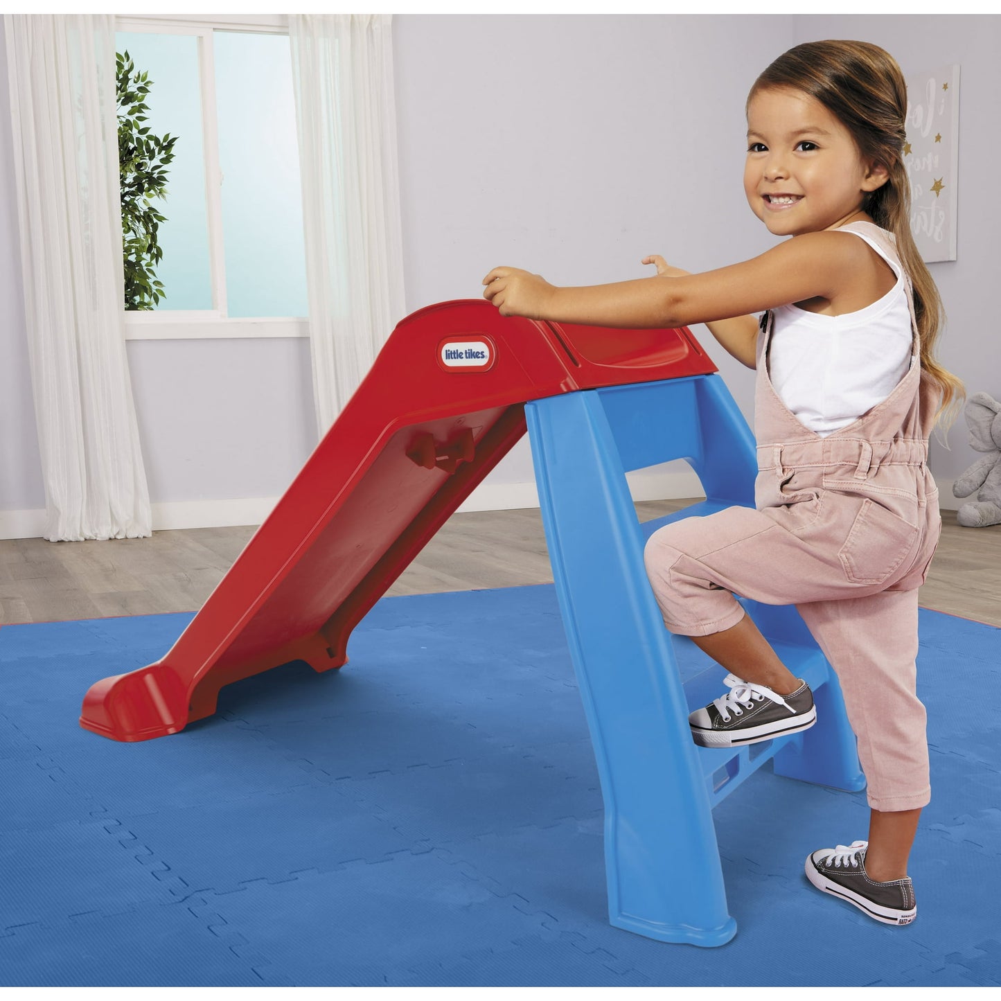 Colorful kids outdoor play equipment for active backyard fun and physical play for toddlers and young children.
