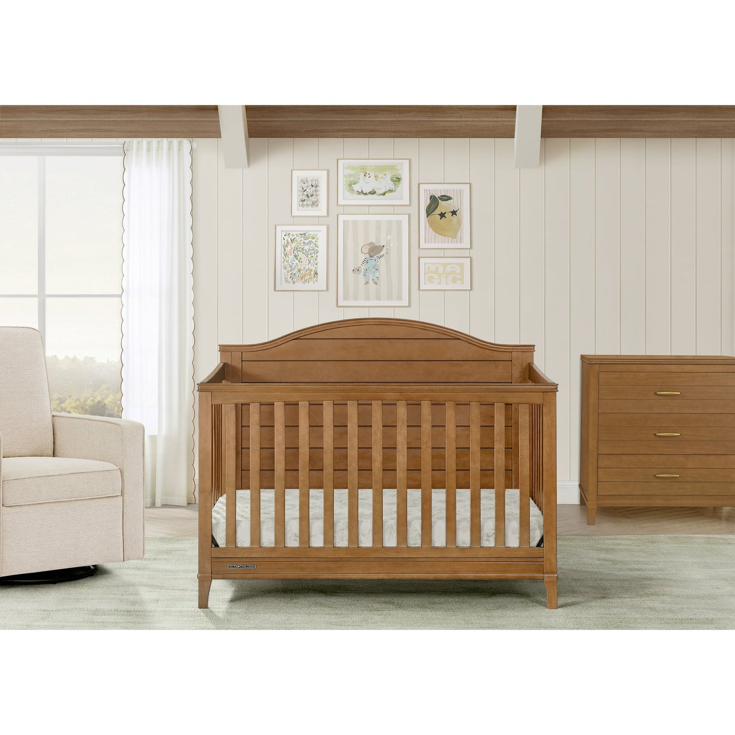 A nursery room featuring a wooden baby crib, a matching dresser, and a glider chair