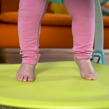 Image displaying a baby in a baby activity jumper