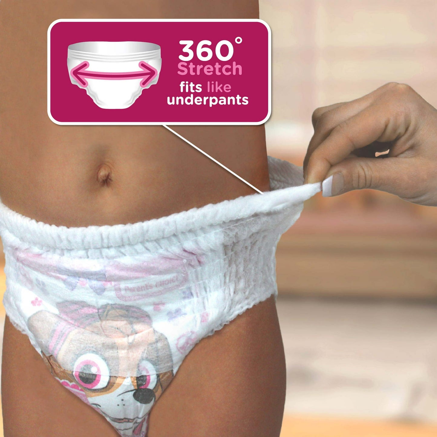 Child wearing a training pant, highlighting 360° stretch for an underpants-like fit