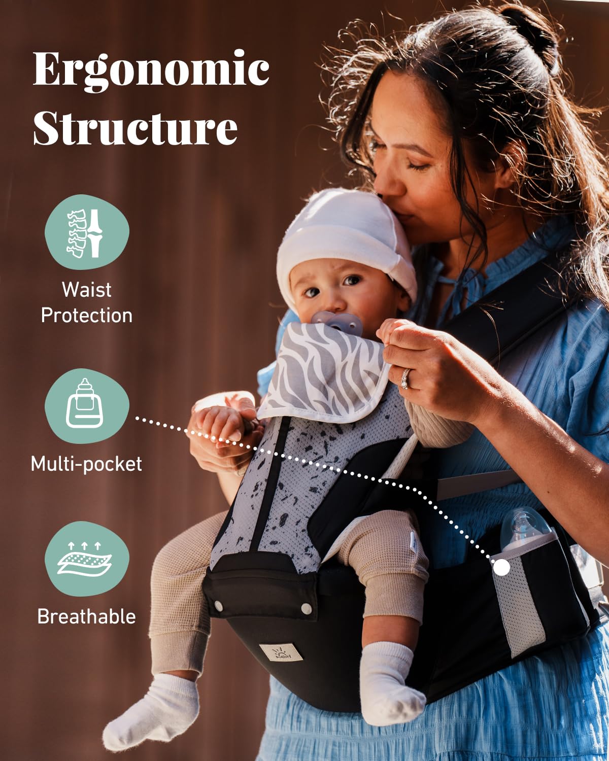 Image displaying a baby in a baby carrier and text about it's details