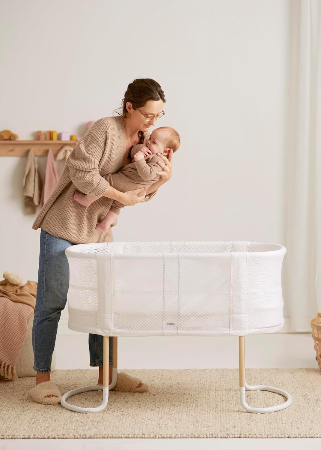 Image displaying a baby bassinet and a women with a baby