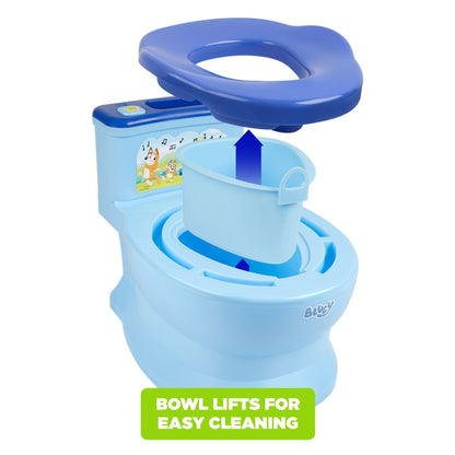 A blue toddler potty trainer with a removable bowl shown lifting for cleaning, with a white background