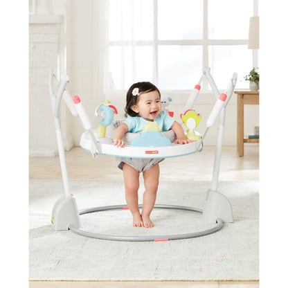 Image displaying a baby in a baby activity jumper