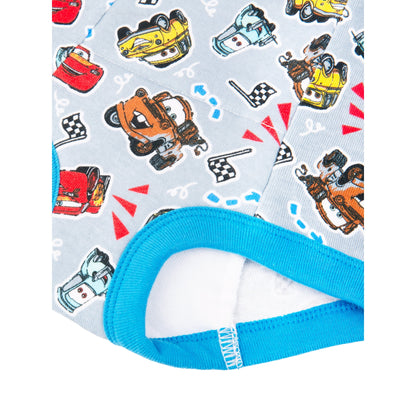 A close-up view of a light blue fabric with a repeating pattern of cartoon race cars and checkered flags, with white background